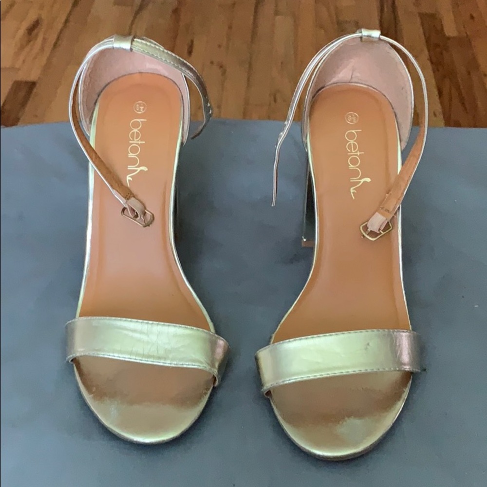 Gold high heels